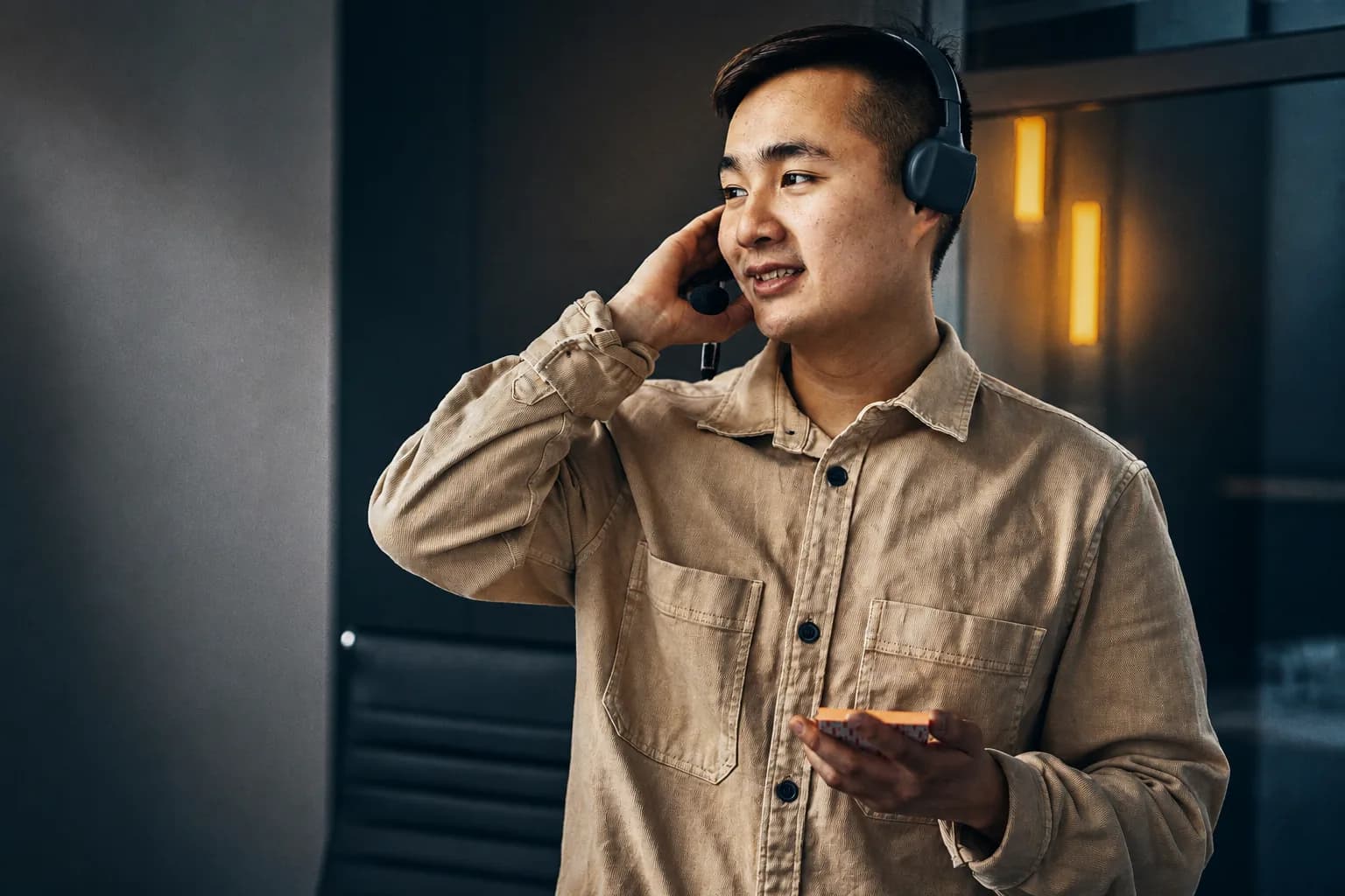 A sales representative using a headset during a customer call