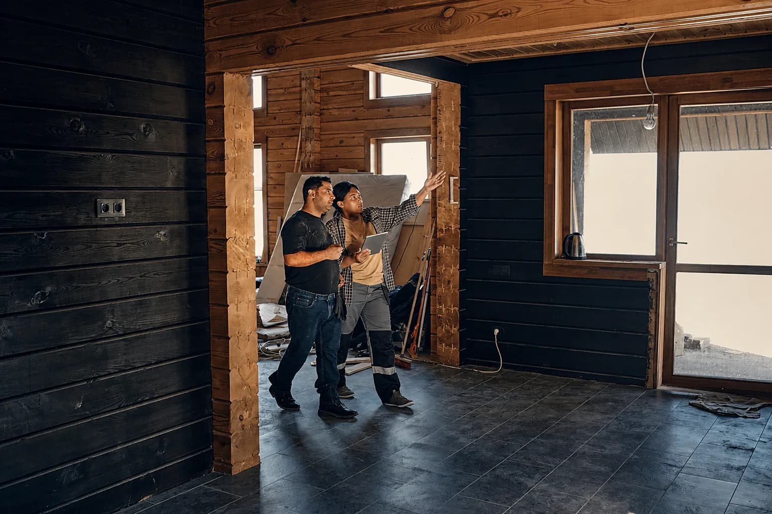 A contractor and homeowner discussing an in-home renovation estimate