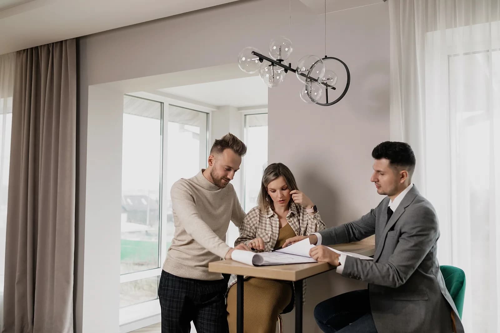 A homeowner reviewing an in-home project estimate with a sales professional